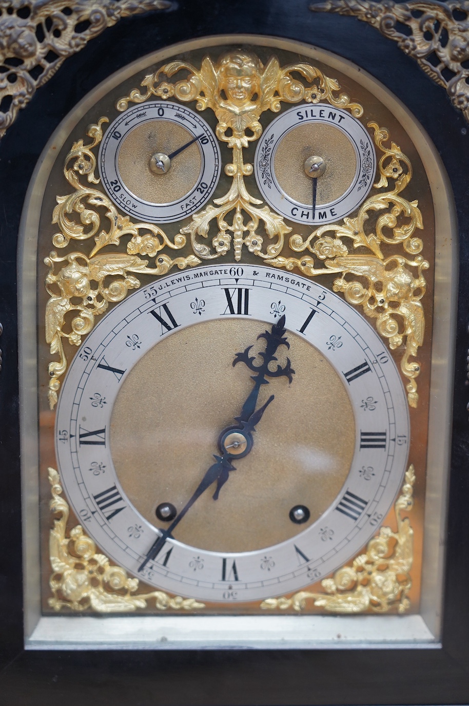 A large Edwardian ebonised mahogany and ormolu mounted bracket clock and bracket, movement by W&H Sch., striking on two coiled gongs, dial signed J. Lewis, Margate and Ramsgate, 71cm high. Condition fair to good, the clo